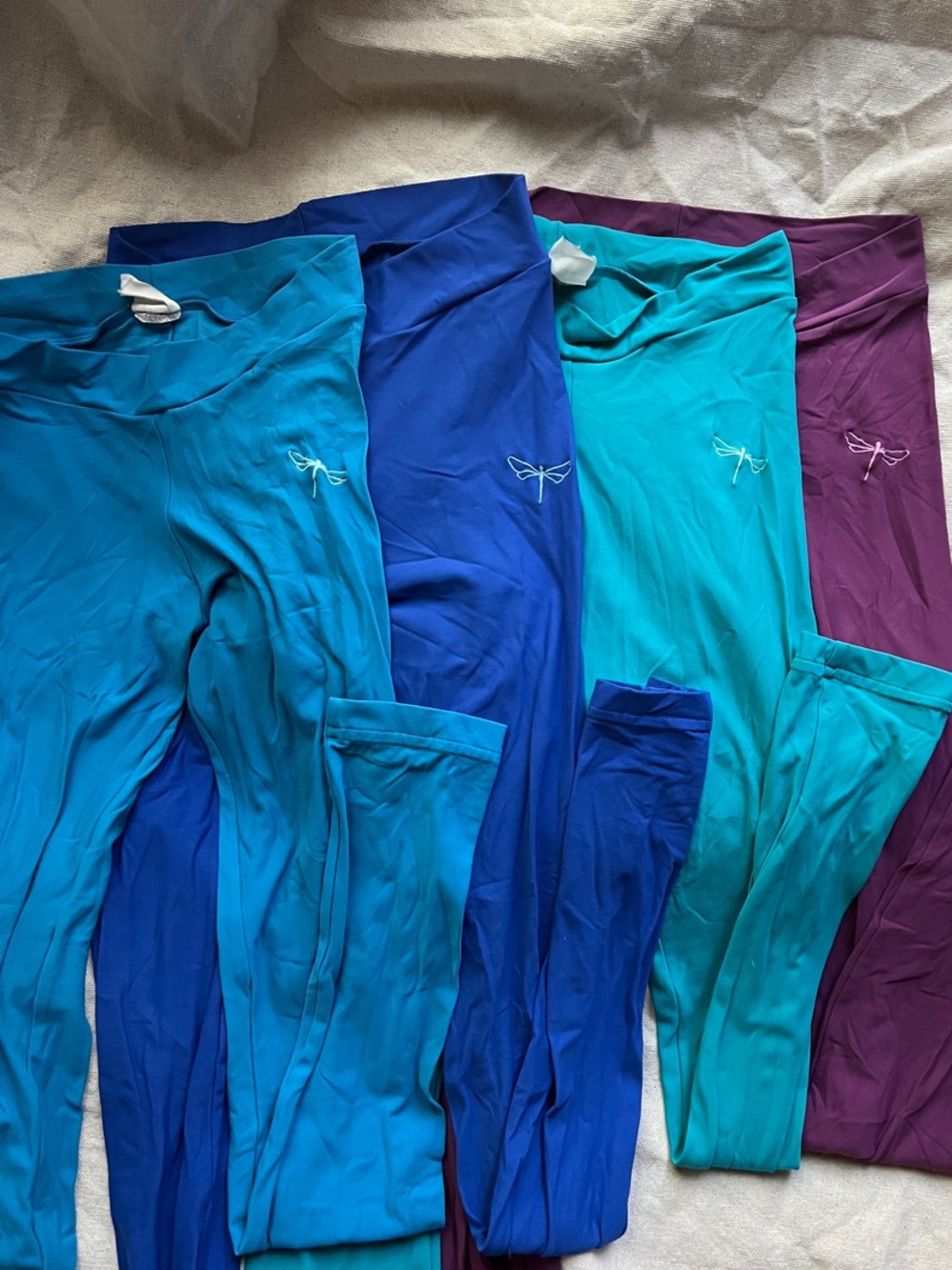 Four pairs of Dragonfly Brand Leggings - Blue, Teal & Purple